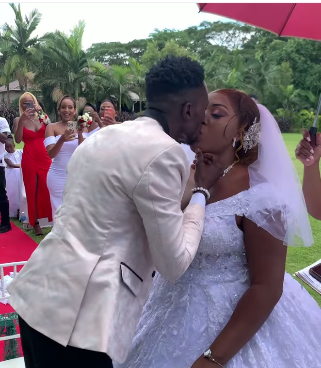 Watch DJ Kandeke give international kiss to his wife